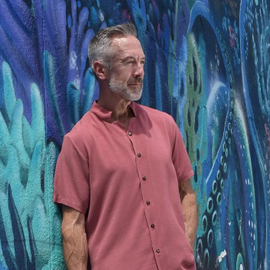 Standing in front of a mural with Clayton Paterson