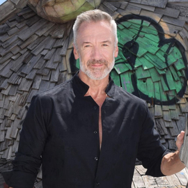 Clayton Paterson posing near art installation